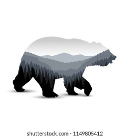 Silhouette of bear with panorama of mountains. Grey tones.