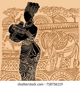 Silhouette of a beautiful African woman in the background of an African landscape