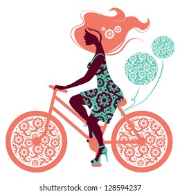 Silhouette of beautiful girl on bicycle