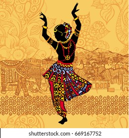 
Silhouette of Beautiful Indian women in the background of the Indian landscape. Dancing woman.