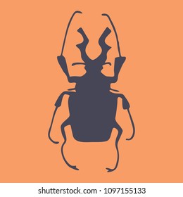 silhouette of a beetle on an orange background