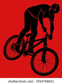 silhouette bicyclist doing bike trick