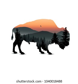 Silhouette of bison with mountain landscape.