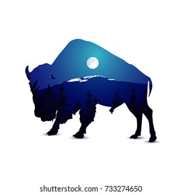 Silhouette of bison with night mountain landscape.