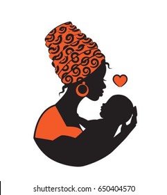 Silhouette of a black African woman in a kerchief holding a child in a sling