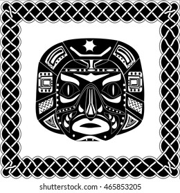 Silhouette black-white mask shaman Native American, Australian Aboriginal or African tribes in the frame boundary in the form of an ancient traditional pattern, ornament