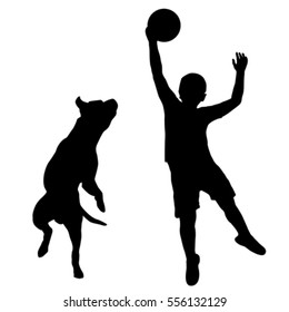 Silhouette Of Boy And Dog Playing Together