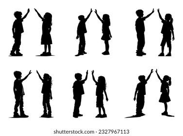 silhouette of boy and girl high fiving, friendship or brotherhood concept