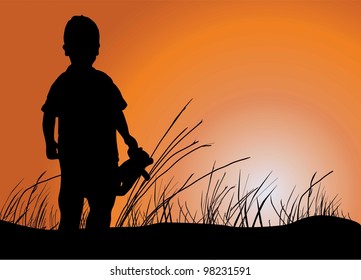 silhouette of a boy on a sunset background