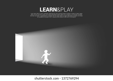 Silhouette of boy running from the door with the light. Concept of education solution.