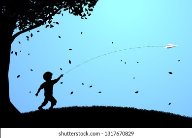 silhouette of boy running to throw out origami paper airplane under the tree. Concept of children play and learn.
