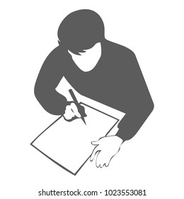 Silhouette of boy sitting and writing in note