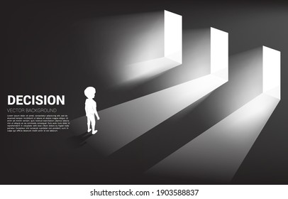Silhouette of boy standing in front of  3 door with light. Concept of education solution and decision of future.