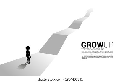 Silhouette de un chico parado en ruta con flecha de crecimiento. Concepto de solución educativa y futuro de los niños.