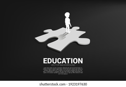 Silhouette of boy standing on route with jigsaw. Concept of education solution and future of children.