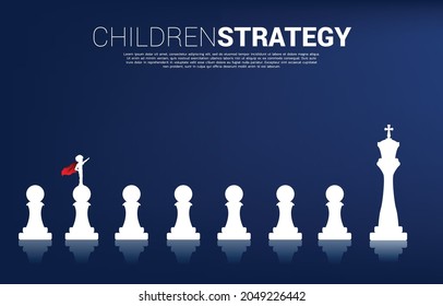 Silhouette of boy in superhero suit standing on chess piece from pawn to king. Concept of education start and future of children.
