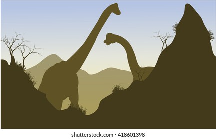 Silhouette of brachiosaurus behind the cliff with brown backgrounds