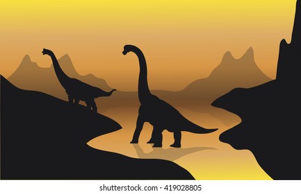 Silhouette of brachiosaurus in river at the sunset