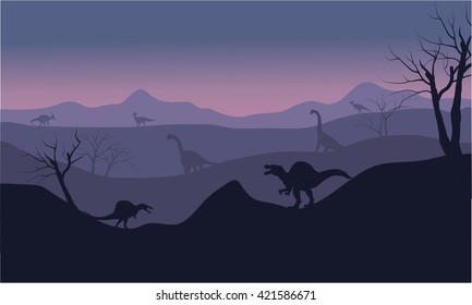 Silhouette of Brachiosaurus and spinosaurus at the sunset