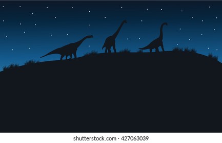 Silhouette of Brachiosaurus with star in hills