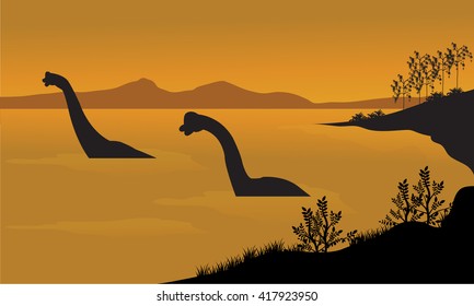 Silhouette of brachiosaurus in the water at the afternoon