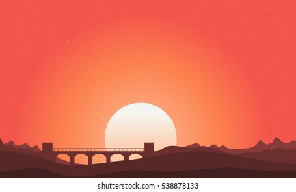 Silhouette of bridge landscape on orange sky