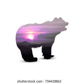 Silhouette of brown  bear with sunset sky and wild mountains. Outdoor background. Abstract tones.