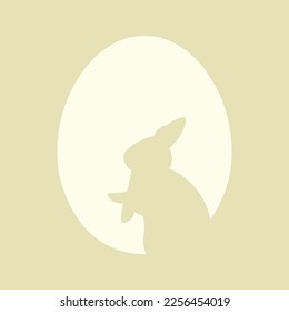 Silhouette of bunny and Easter egg on color background