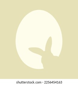 Silhouette de conejito y huevo de Pascua sobre fondo de color