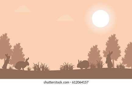 Silhouette of bunny at sunset landscape vector art