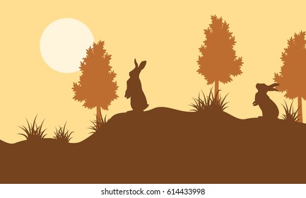 Silhouette of bunny and tree landscape vector art