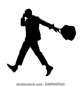 Silhouette of a business man carrying a briefcase