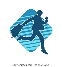 Silhouette of a business man carrying a briefcase