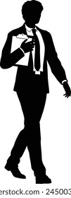 Silhouette business person man in a smart suit and tie holding a clipboard.