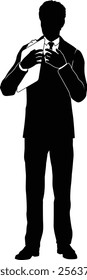 Silhouette business person man in a smart suit and tie holding a clipboard.