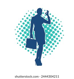 Silhouette of a business woman wearing office work women suit in pose carrying briefcase