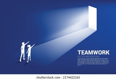 Silhouette of businessman and businesswoman point ahead to exit door. Concept of career start up and business solution.