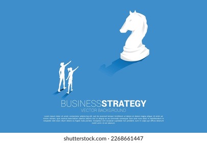 Silhouette of businessman and businesswoman point forward with chess piece. concept of business strategy marketing.