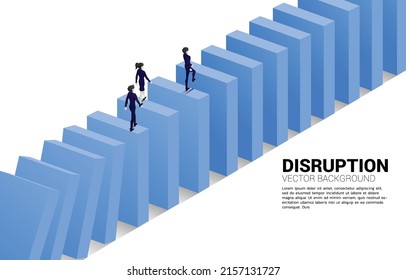 Silhouette of businessman and businesswoman walking on domino collapse. Concept of business industry disrupt