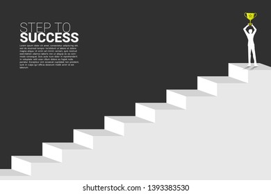 silhouette of businessman with champion trophy on top of stair. Concept of growth business, Success in Career path.