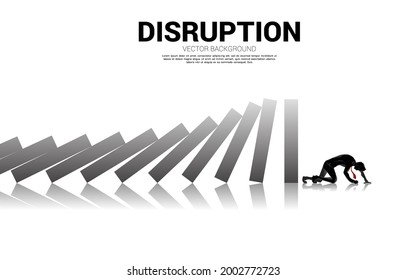 Silhouette of businessman crawl at the end of domino collapse. Concept of business industry disrupt.