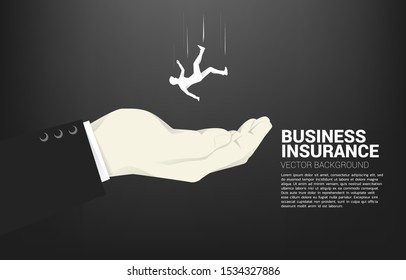 silhouette of businessman falling down in big hand. Concept for safety and insurance business