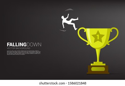 silhouette of businessman falling from trophy. Concept for fail and accidental business