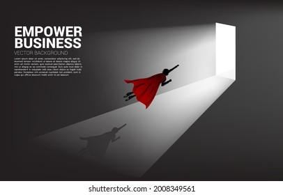 Silhouette of businessman flying to exit door. Concept of career start up and business solution.