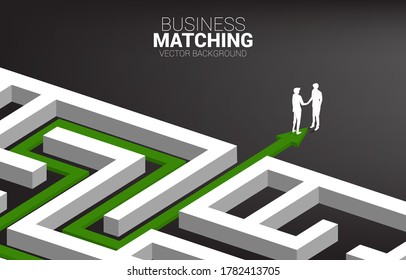 Silhouette of businessman handshake at exit from maze. Concept of business matching. Team work  partnership and cooperation.