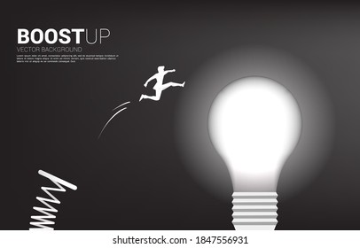 Silhouette of businessman jump to light bulb with springboard . Business Concept of creative idea and solution.