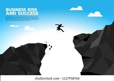 Silhouette of businessman jump over the abyss to higher cliff. Concept of risk and success in business
