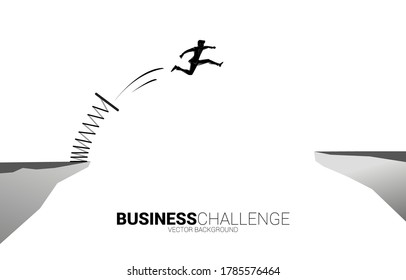 Silhouette of businessman jump over the gap with springboard. Concept of boost and growth in business.