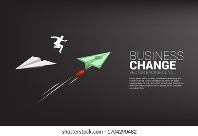 silhouette of businessman jump from white origami paper airplane to bank note money for change direction. Business Concept of changing business direction.Company vision mission.