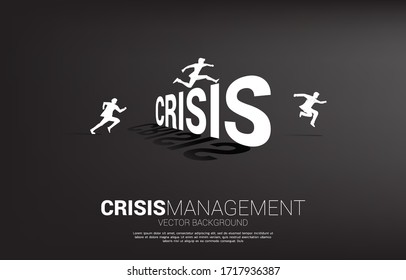 Silhouette businessman jumping across Crisis. Background concept for crisis management and challenge in business